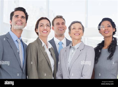 Business people looking up Stock Photo - Alamy