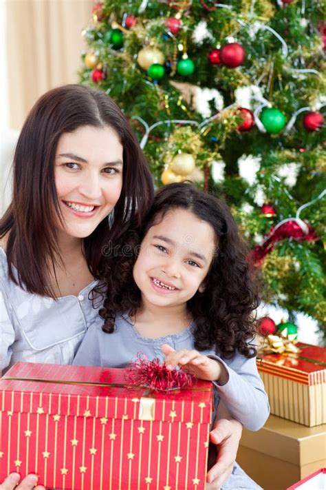 Girl Surprising Her Mother With Christmas Gift Stock Image Image Of Brunette Delighted 7758401