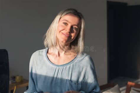 Portrait Of Smiling Mature Woman Looking At Camera Stock Image Image
