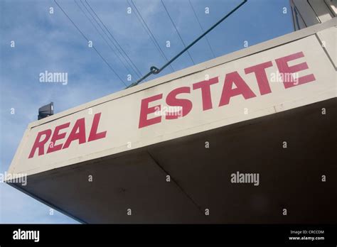 Real Estate Sign At Estate Agent Offices Queensland Australia Stock