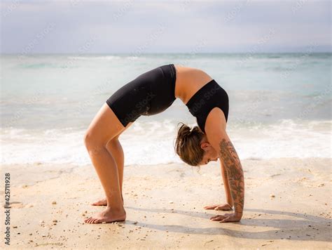 Outdoor Yoga Caucasian Woman Practicing Chakrasana Or Urdhva