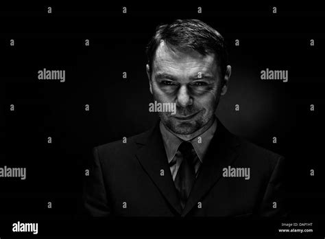 Portrait Of Mature Man Against Black Background Close Up Stock Photo Alamy