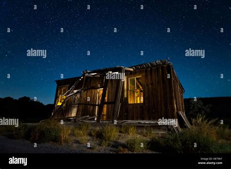 Old abandoned shack at night under a starry Nevada sky Stock Photo - Alamy