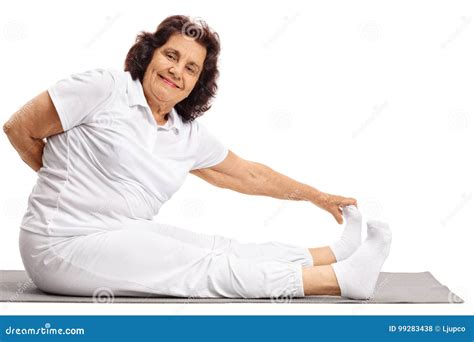 Elderly Woman Stretching On An Exercise Mat Stock Photo Image Of