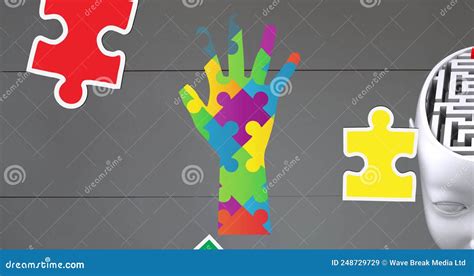 Image Of Autism Awareness Month Colourful Puzzle Pieces Forming Hand