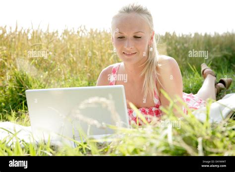 Blonde Woman With Laptop Stock Photo Alamy