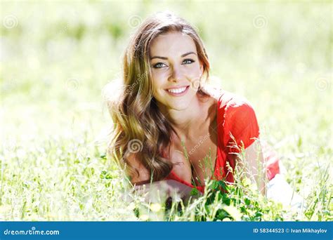 Young Woman In Red Dress Lying On Grass Stock Image Image Of Grass