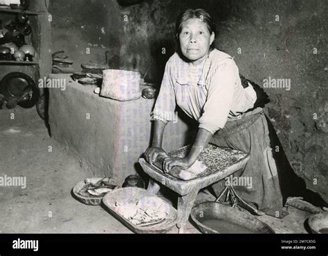 Tarascan Woman Grinding Corn On The Metate Quern In A Village Ihuatzio