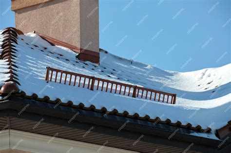 Premium Photo Snow Guard For Safety In Winter On House Roof Top Covered With Ceramic Shingles