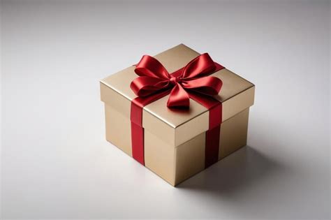 Arafed Gift Box With A Red Ribbon And Bow On A White Surface Premium