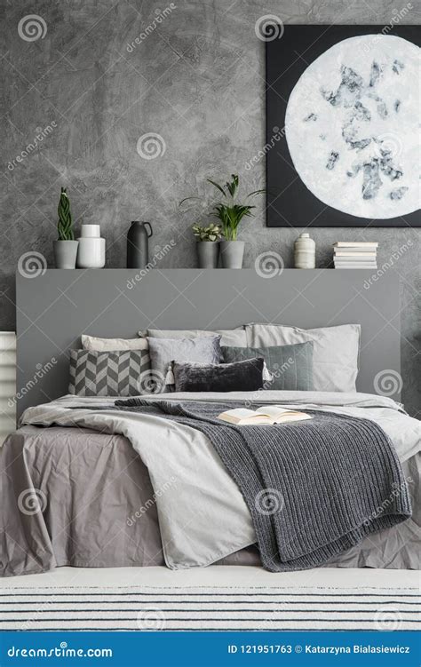 Monochromatic Bedroom Interior in Shades of Grey with Many Cushi Stock ...