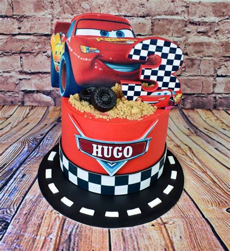 A Birthday Cake Made To Look Like The Cars Movie Character From Disney