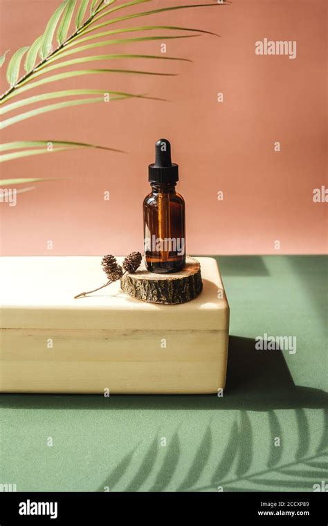 Blank Amber Glass Essential Oil Bottle On Wooden Brick Natural Organic