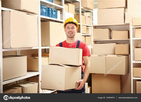 Young Man Holding Boxes Royalty Free Photo Stock Image By © Belchonock