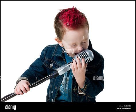 Little Boy Singing Into A Microphone Stock Photo Alamy