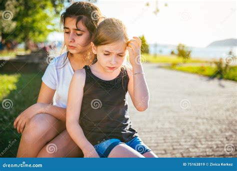 Two Sad Girls Hugging