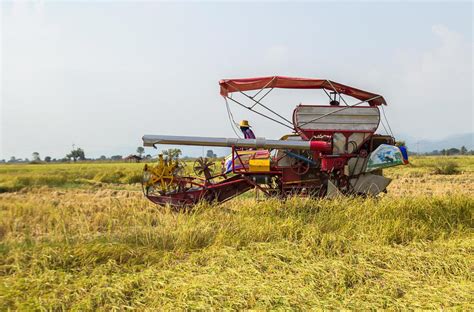 Tractor Harvesting Field Stock Photos, Images and Backgrounds for Free ...