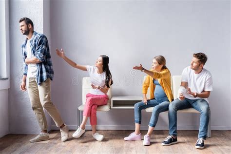 Four Multicultural People Waiting In Hall Stock Image Image Of People