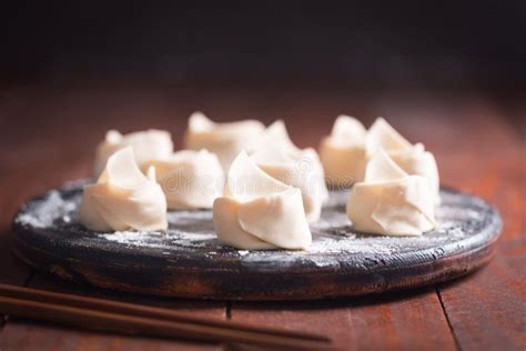 Raw Wonton Chinese Dish Made From Dough And Fillings Stock Photo