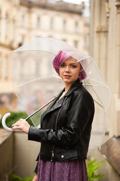 Premium Photo Cheerful Pretty Girl Holding Umbrella While Strolling