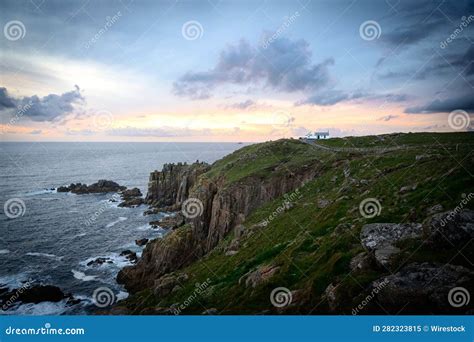 Magical Lighthouse Standing On A Grassy Hill Overlooking The Sea Stock Image Image Of Rocks