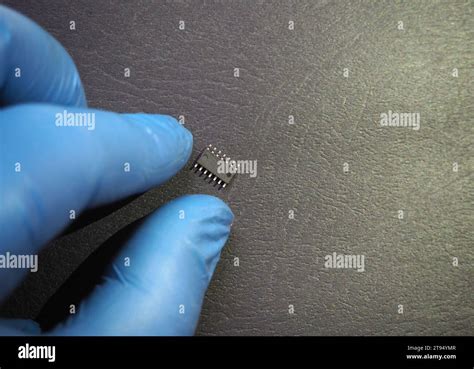 Semiconductor Industry Hand Holding An Electronic Micro Chip 14 Pins