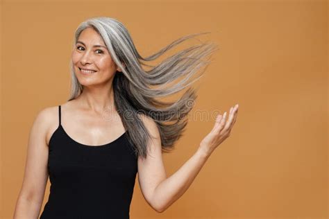 Mature Asian Woman With Grey Hair Smiling And Looking At Camera Stock