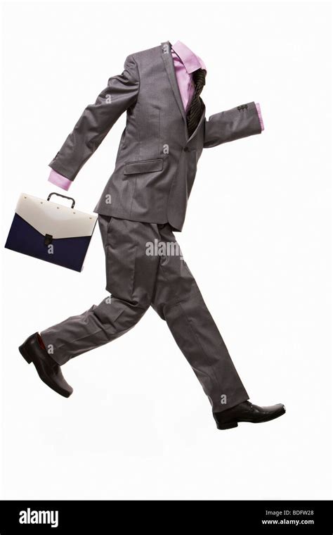 A Male Suit With Briefcase Running Stock Photo Alamy