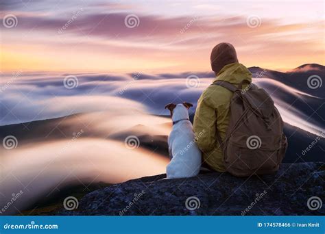 Alone Tourist Sitting On The Edge Of The Cliff Stock Photo Image Of