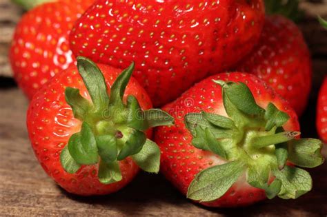 Single Well Formed Strawberry In Group Of Strawberries Fruits Macro