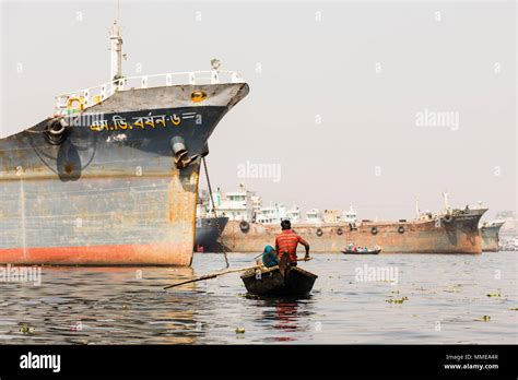 Dhaka Bangladesh February 24 2017 Wooden Taxi Boat With Passengers And A Cargo Ship In