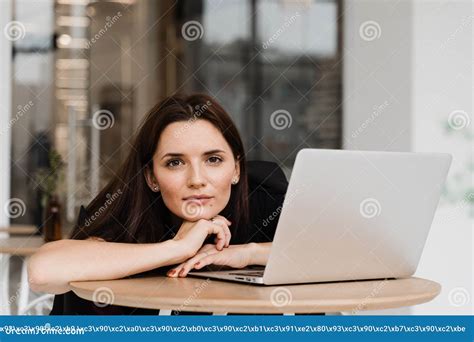 Confident Young Business Woman Working Online With Team On Laptop On