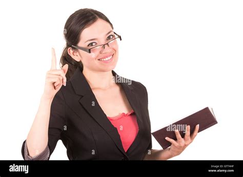 Portrait Of Pretty Female Teacher Wearing Glasses And Holding Book