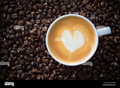 Hot Coffee On Coffee Bean Background Stock Photo Alamy