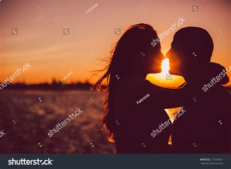 Silhouette Couple Kissing Over Sunset Background Stock Photo (Edit Now ...