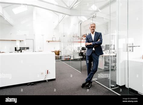 Portrait Of Confident Mature Businessman In Office Stock Photo Alamy