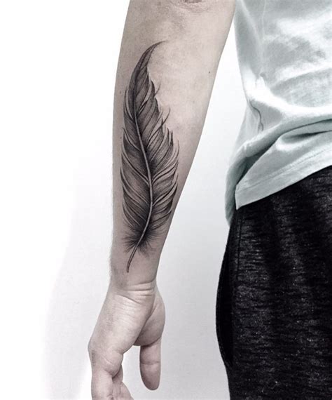 50 Beautiful Feather Tattoo Designs Tattooadore Feather Tattoo