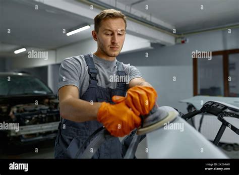 Serviceman Polishing Car Body Part In Workshop Stock Photo Alamy