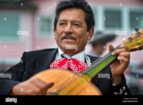 Mariachi musician playing guitar Stock Photo - Alamy