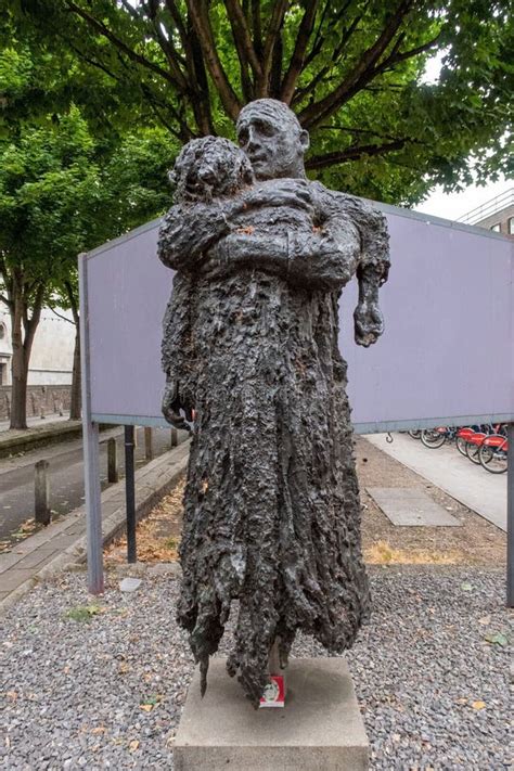 Vertical Image Of The Return Of The Prodigal Sculpture By Charlie