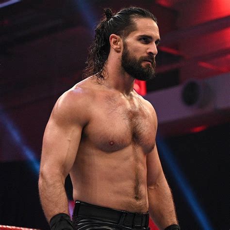 A Man With Long Hair And No Shirt Standing In A Ring Wearing Black