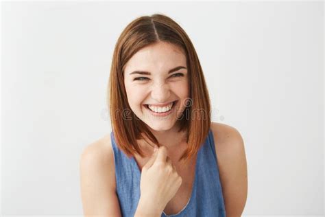 Portrait Of Cheerful Happy Young Beautiful Girl Laughing Smiling Over