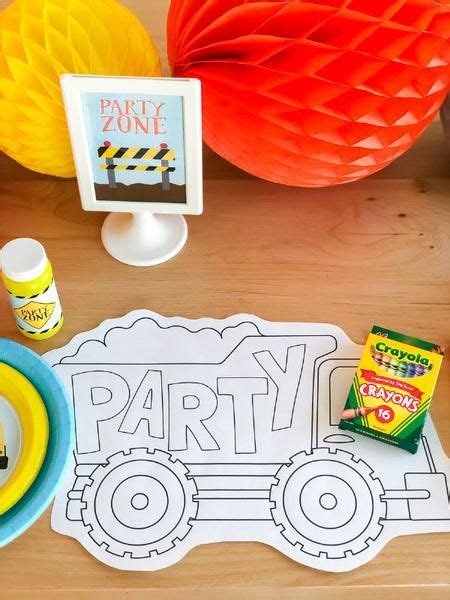 A Party Table Set Up With Construction Paper Plates And Napkins Candy