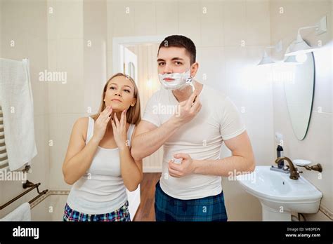 Couple In The Morning In The Bathroom Doing Personal Hygiene Romantic