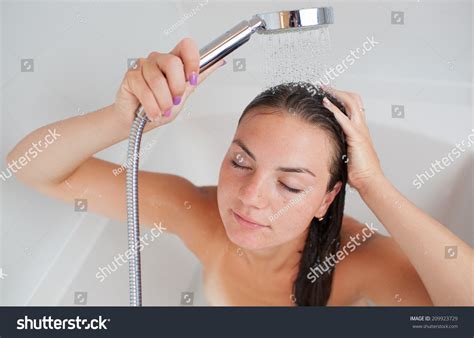 Beautiful Young Woman Taking A Shower Hot Bath Tub And Washing Hair