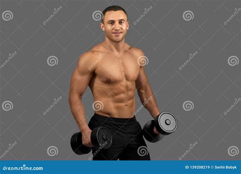 Man With Muscular Torso Posing Holding Dumbbells Stock Image Image