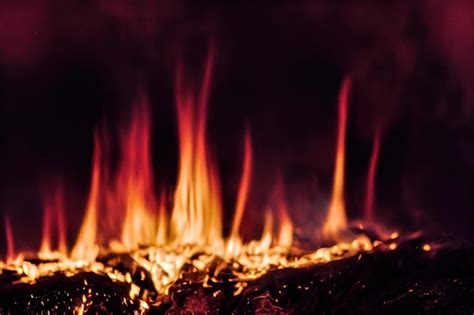 Premium Photo Smoldering Ashes Of A Bonfire With Forks Of Flame