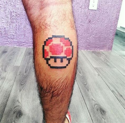 59 Pixel Tattoo Designs That Remind Us How Much We Love Video Games