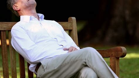 Elderly Man Sleeping On Bench Stock Footage Video Royalty Free