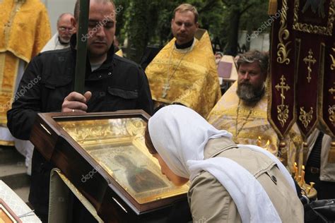 Orthodox Believer Kisses The Icon Of The Virgin Mary Stock Editorial